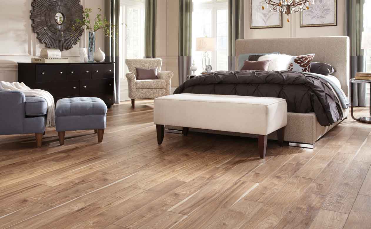 Bedroom with wood look tile flooring